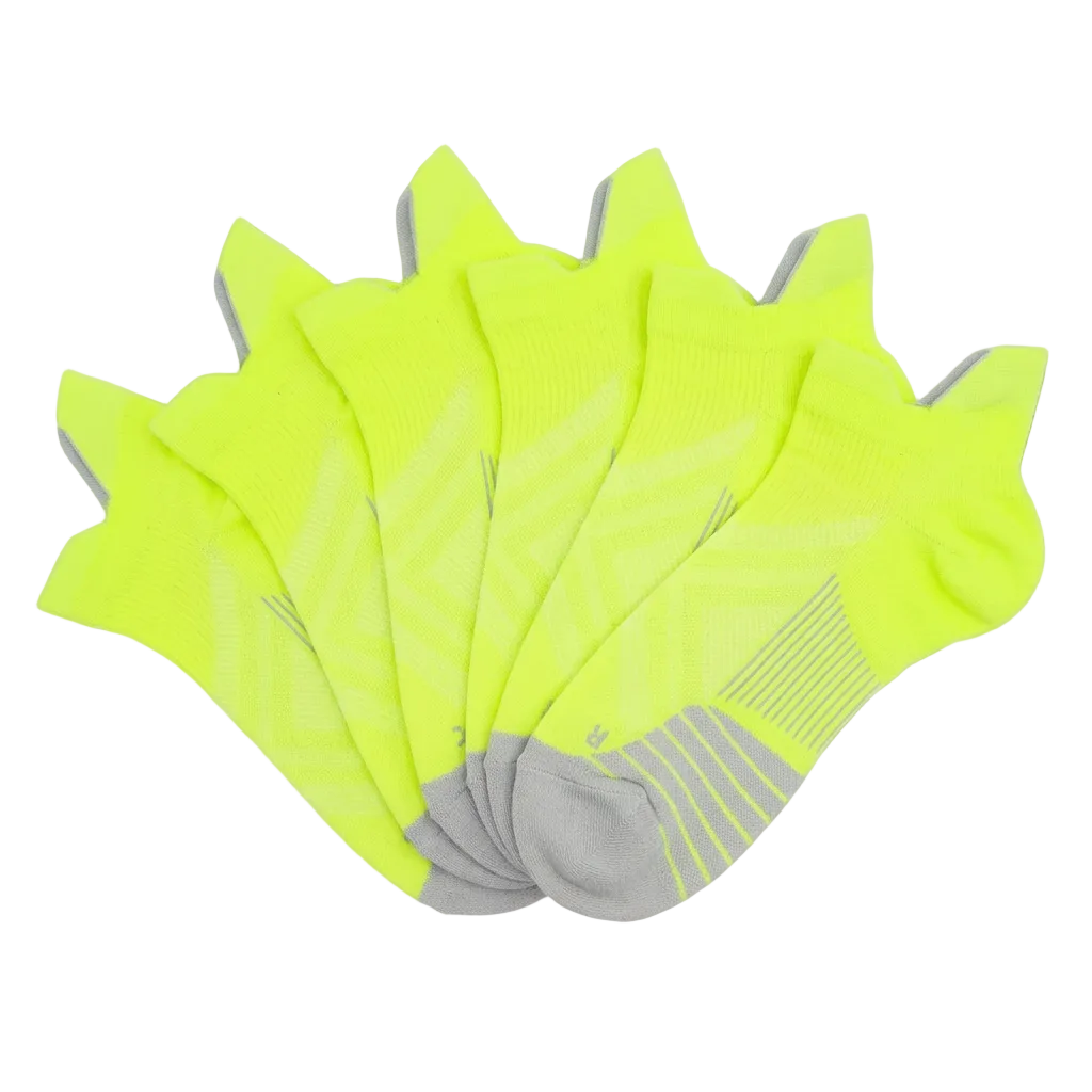 Yellow no-show compression socks in an overlapping fan arrangement